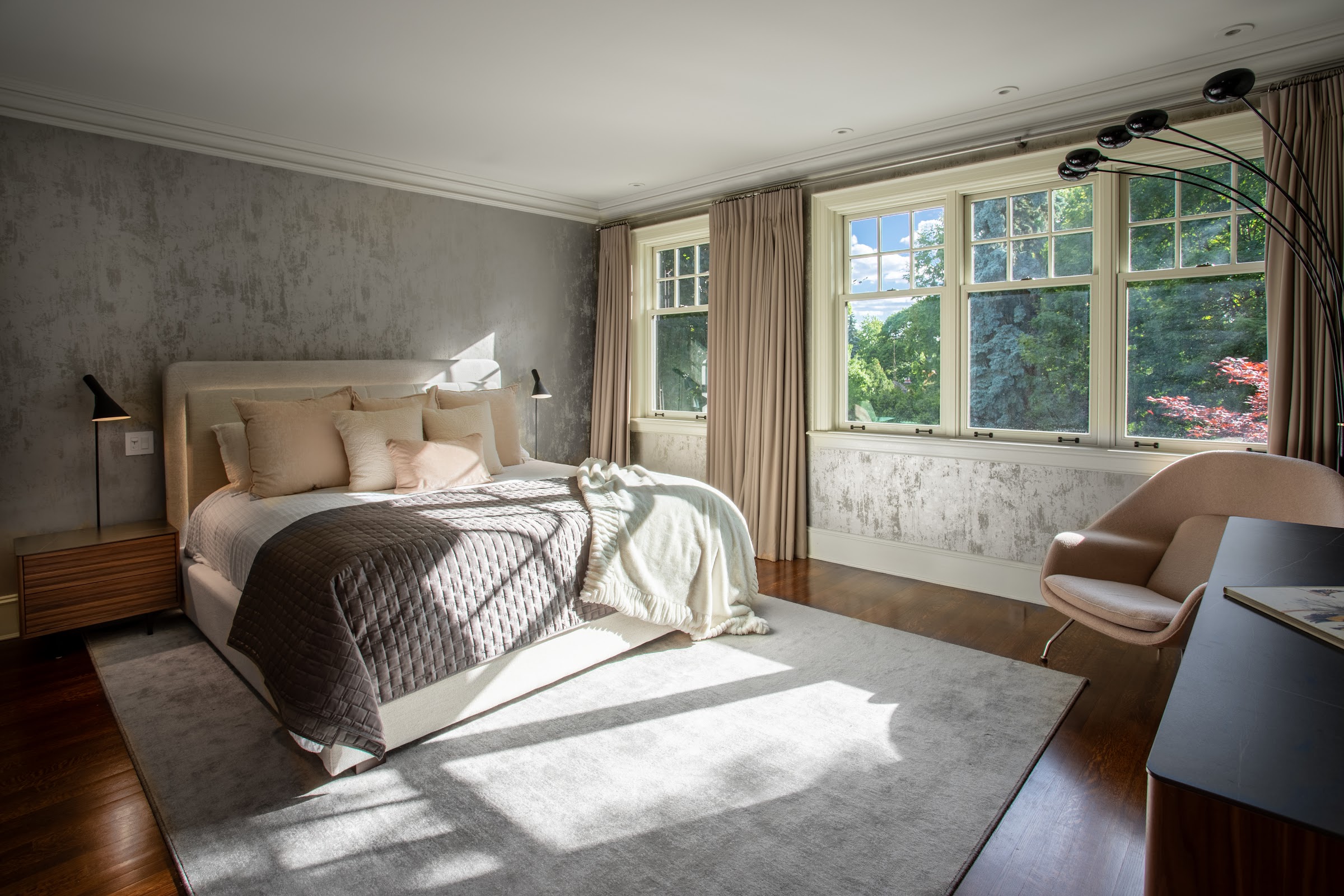Serene primary bedroom filled with light